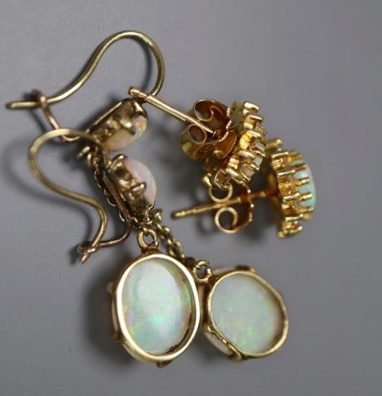 A pair of yellow metal and two stone oval white opal drop earrings, 32mm, gross 2.5 grams, and a pair of 750 and opal ear studs